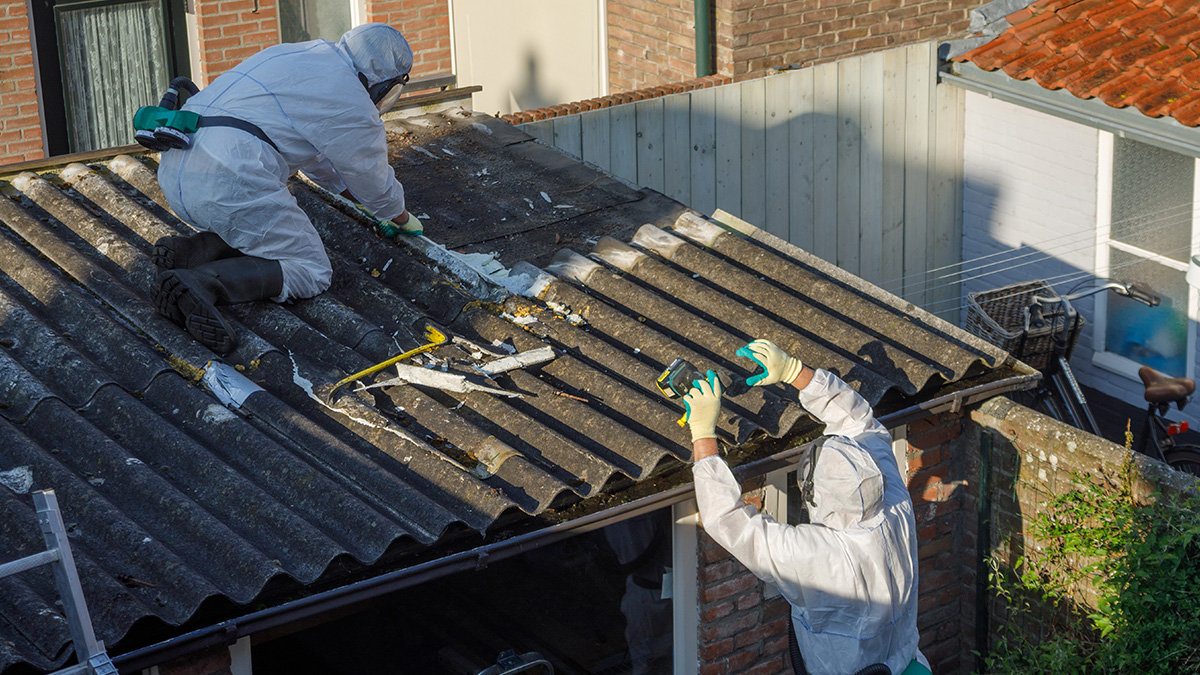 Photo of men removing an asbestos roof